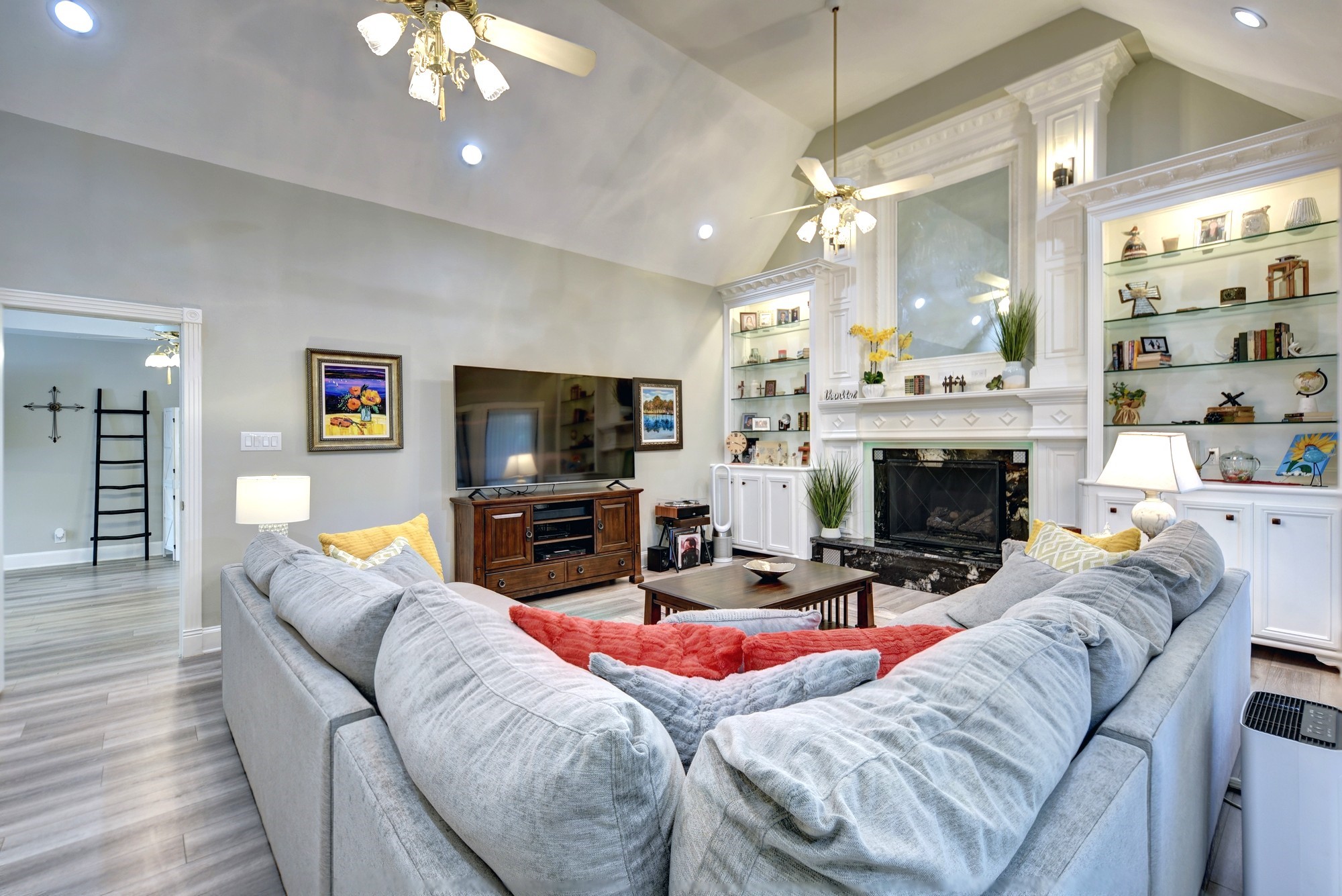 1950 Country Club Road Brenham, TX 77833 - Photo 12 of 39 a living room with furniture a fireplace and a flat screen tv