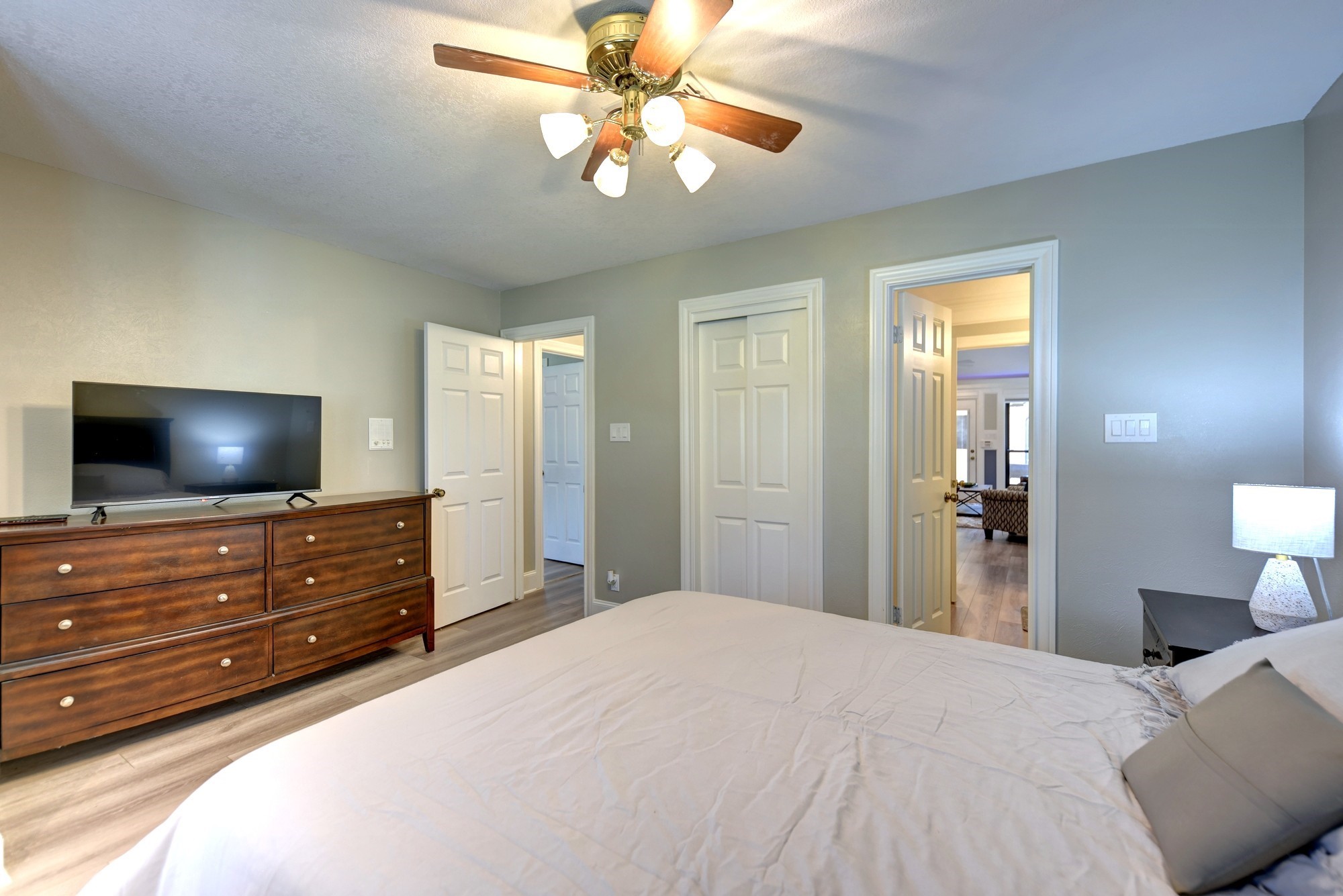 1950 Country Club Road Brenham, TX 77833 - Photo 26 of 39 a bedroom with a bed and a flat screen tv
