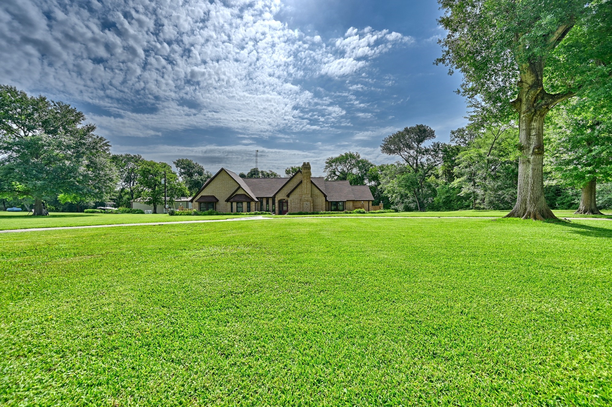 1950 Country Club Road Brenham, TX 77833 - Photo 5 of 39 a view of a field of grass and trees