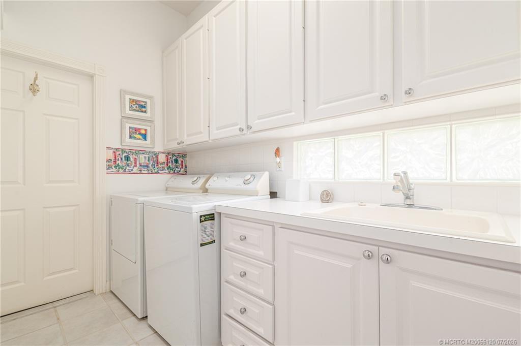 1313 Southwest Balmoral Trace Stuart, FL 34997 - Photo 70 of 70 Current condition - Large laundry room leads to 2 car garage