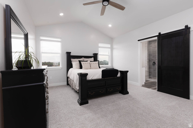 186 West 580 North Redmond, UT 84652 - Photo 23 of 74 Bedroom featuring a barn door, light colored carpet, vaulted ceiling, recessed lighting, and ceiling fan