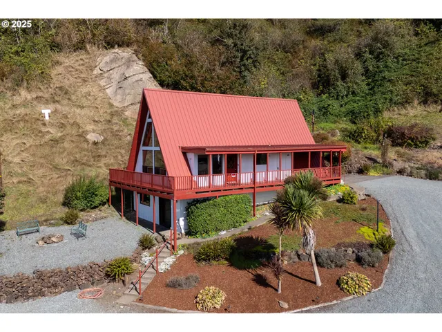 a aerial view of a house with a yard