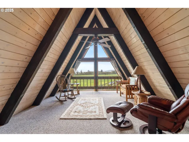 a view of living room with furniture and floor to ceiling window
