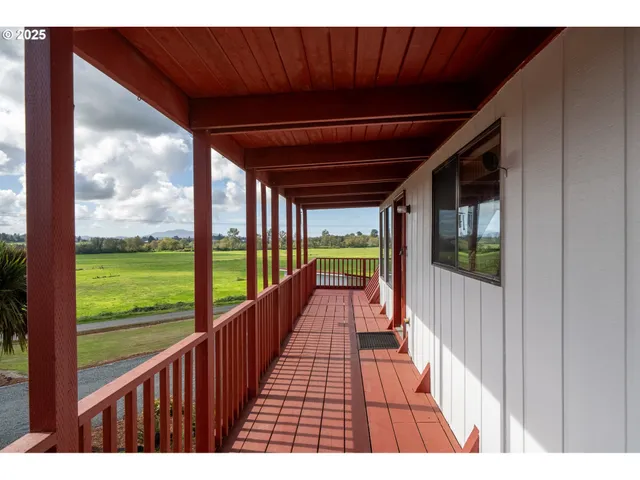 a view of balcony with yard