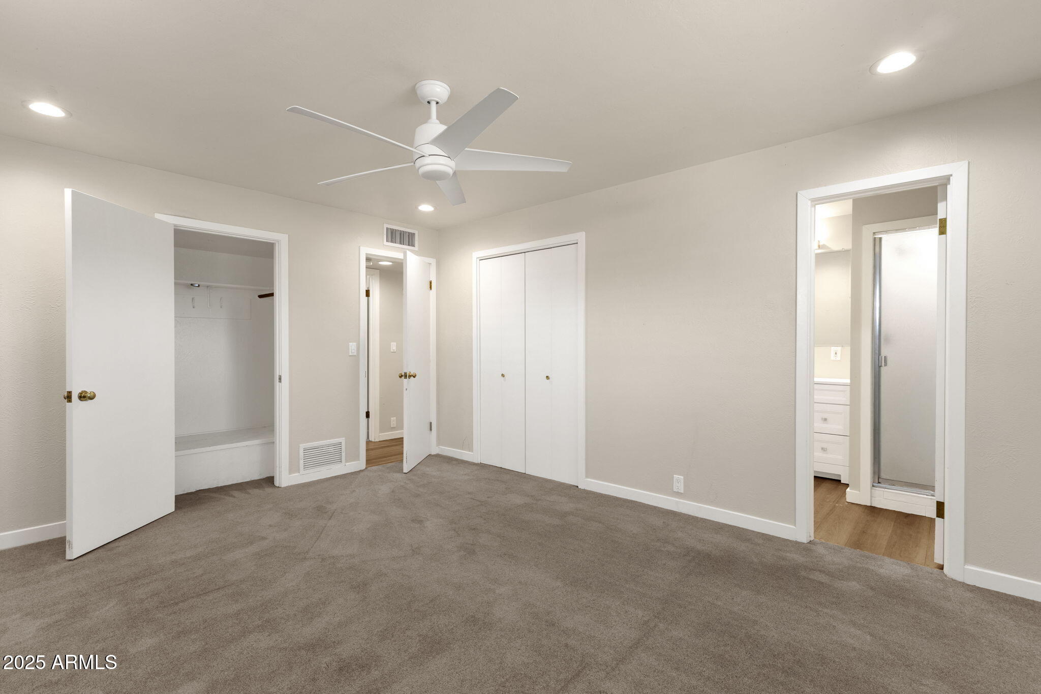 2139 South La Rosa Drive Tempe, AZ 85282 - Photo 17 of 29 an empty room with fan and entrance