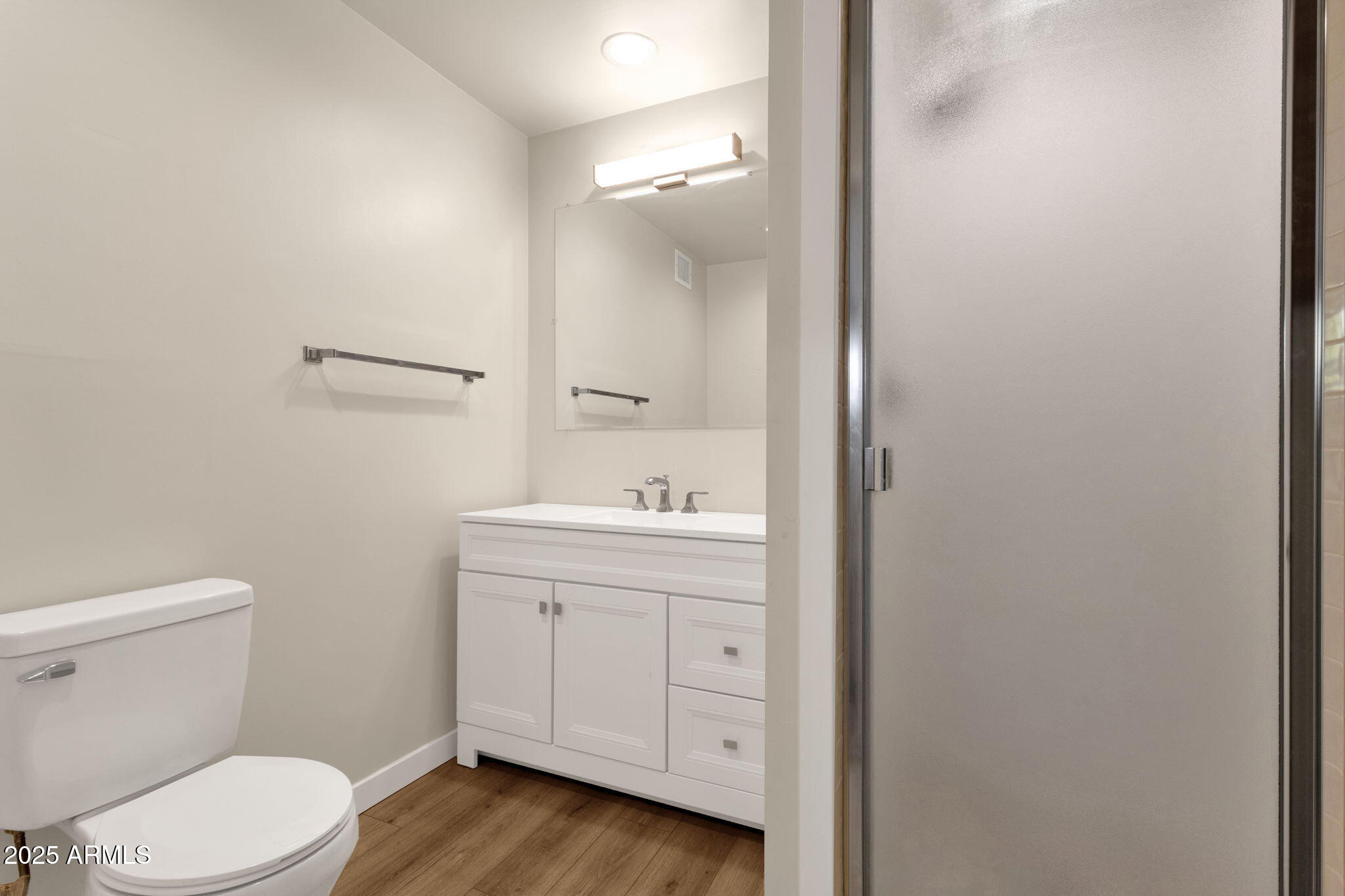 2139 South La Rosa Drive Tempe, AZ 85282 - Photo 18 of 29 a bathroom with a sink a toilet and vanity