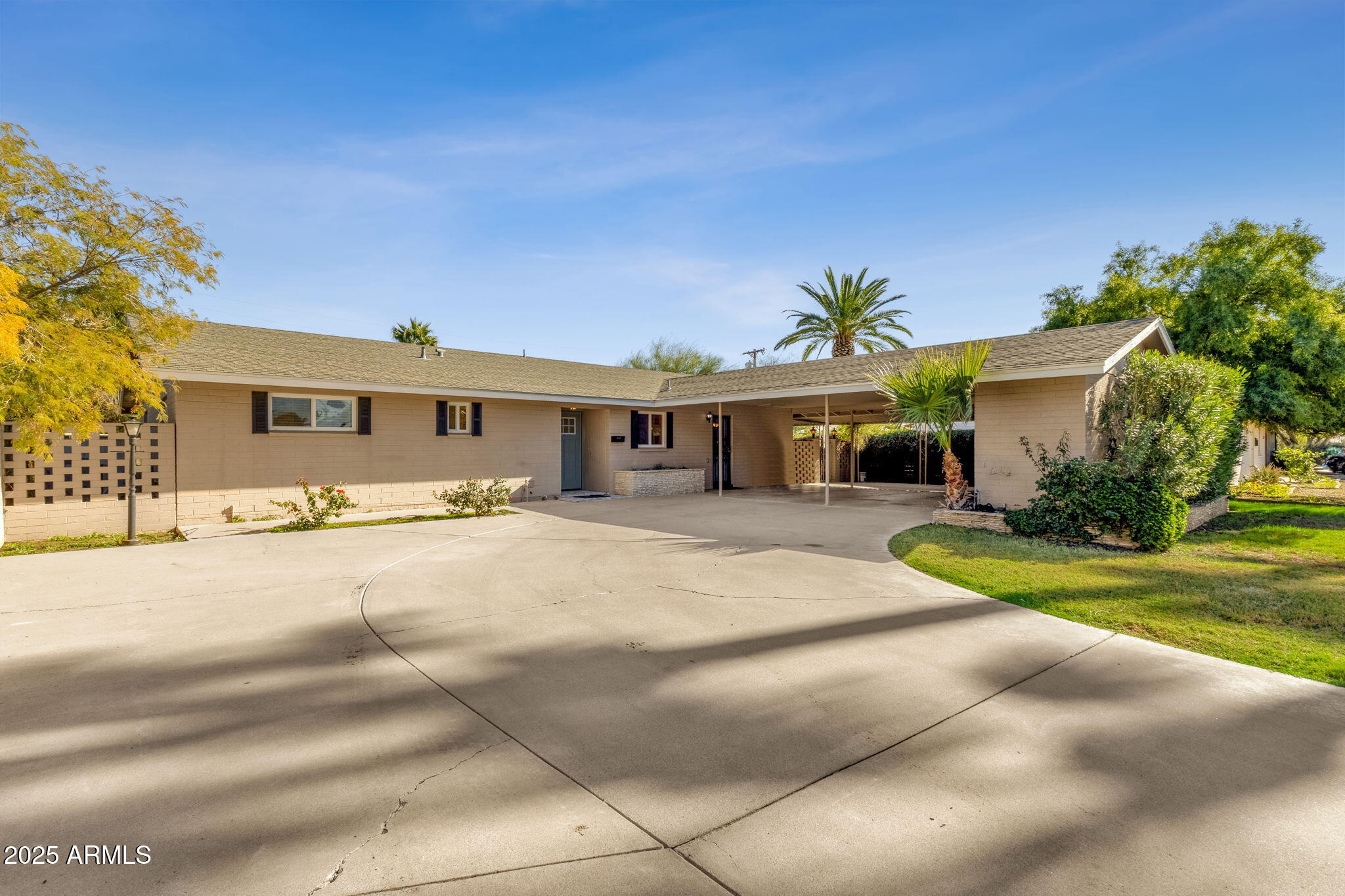 2139 South La Rosa Drive Tempe, AZ 85282 - Photo 2 of 29 a front view of a house with a yard and garage