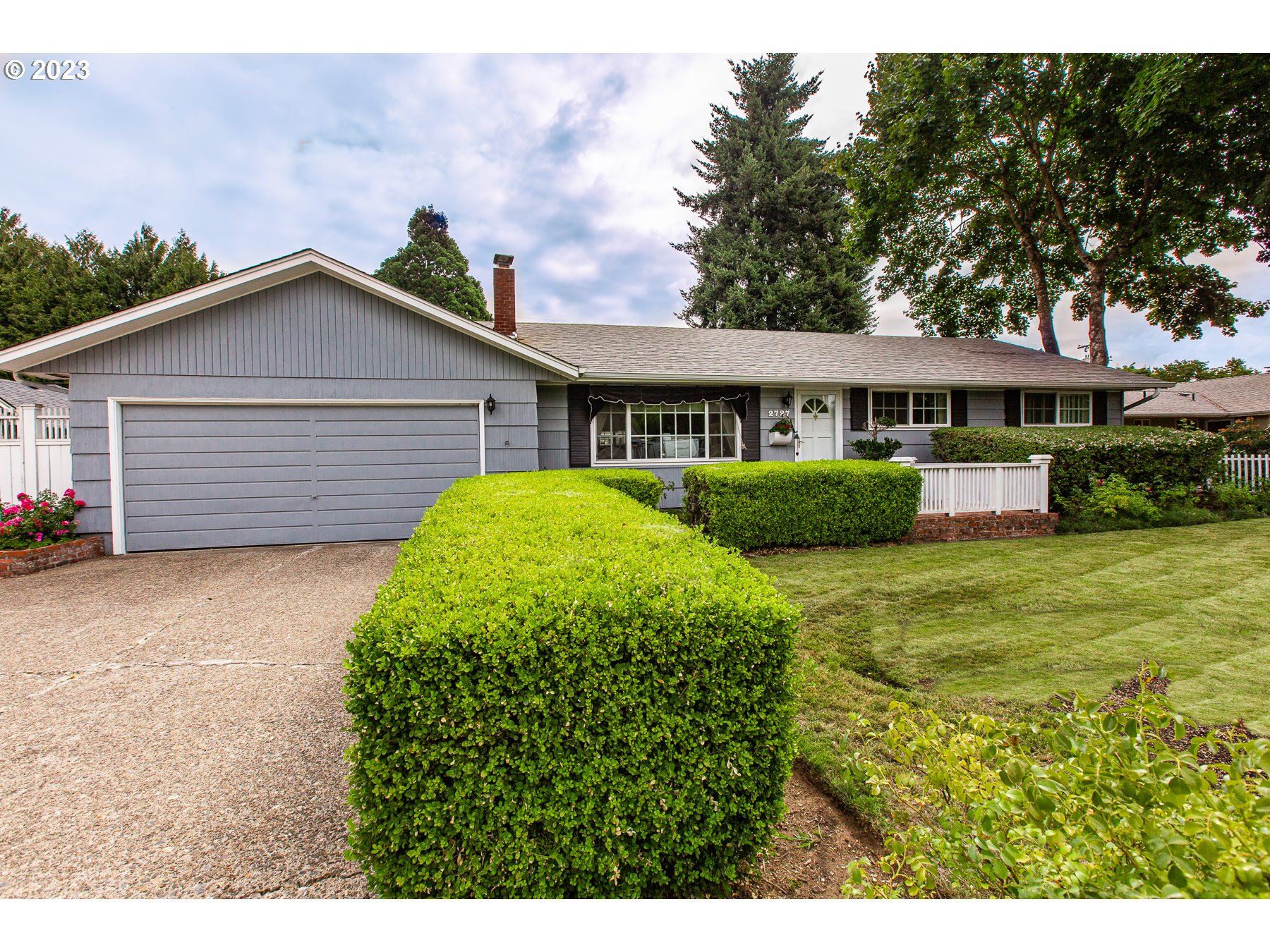2727 Villa Way Springfield, OR 97477 - Photo 3 of 41 a view of a house with a garden and plants