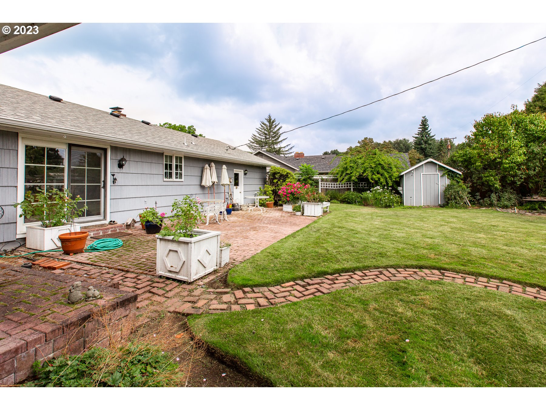 2727 Villa Way Springfield, OR 97477 - Photo 32 of 41 a view of a house with backyard and sitting area