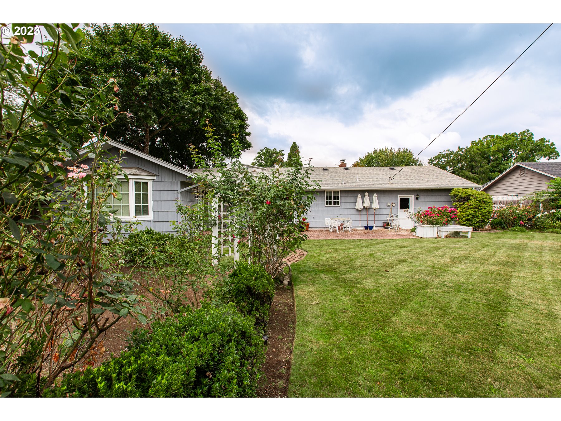 2727 Villa Way Springfield, OR 97477 - Photo 35 of 41 a view of house with garden space and trees