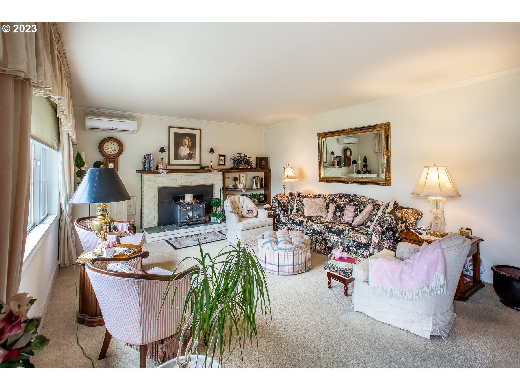 2727 Villa Way Springfield, OR 97477 - Photo 6 of 41 a living room with furniture a fireplace and a flat screen tv