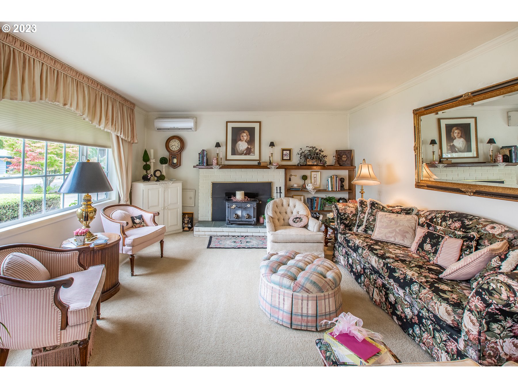 2727 Villa Way Springfield, OR 97477 - Photo 8 of 41 a living room with furniture large window and a fireplace