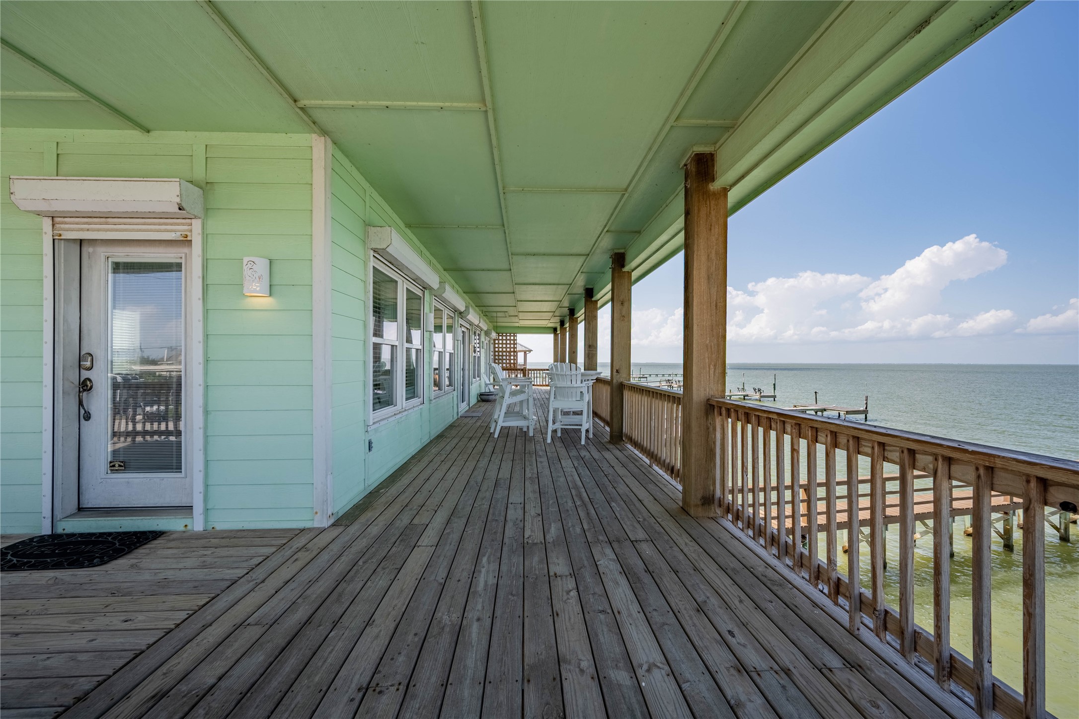 740 Copano Cove Road Rockport, TX 78382 - Photo 7 of 35 a view of balcony with wooden floor