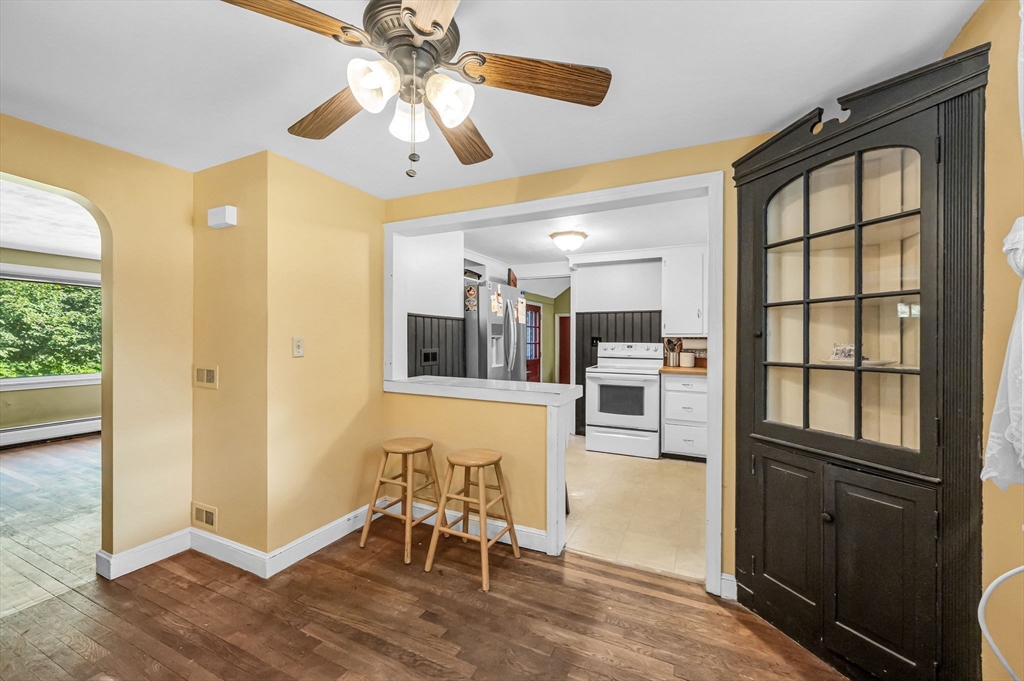58 Bennett Road Hampden, MA 01036 - Photo 11 of 41 a view of a livingroom with wooden floor and a ceiling fan