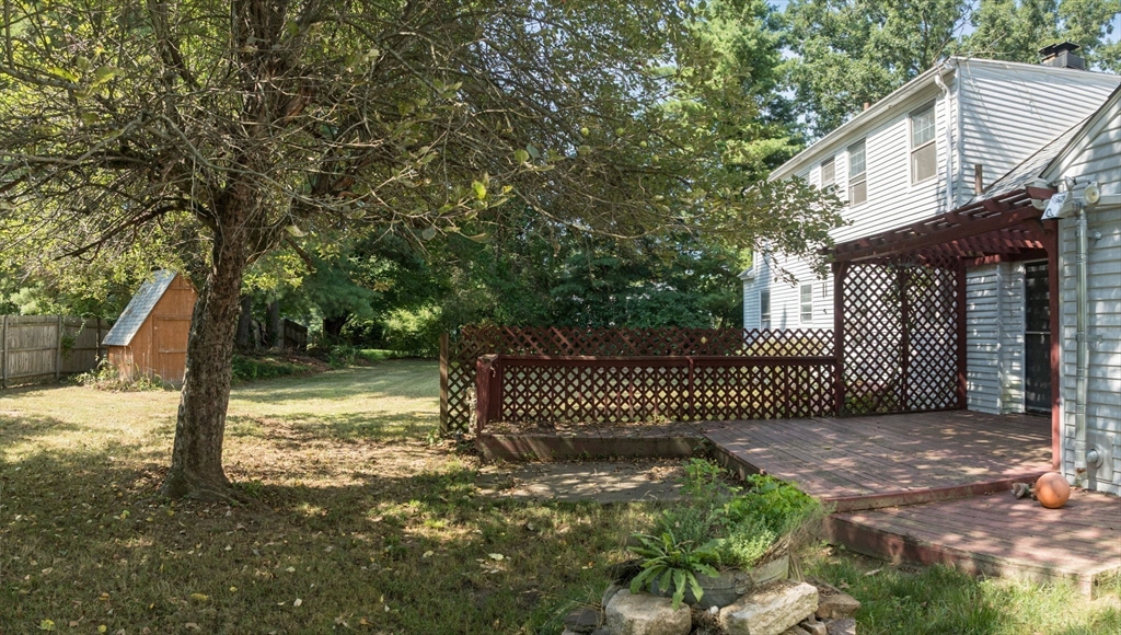 58 Bennett Road Hampden, MA 01036 - Photo 36 of 41 a view of a house with a small yard and wooden fence