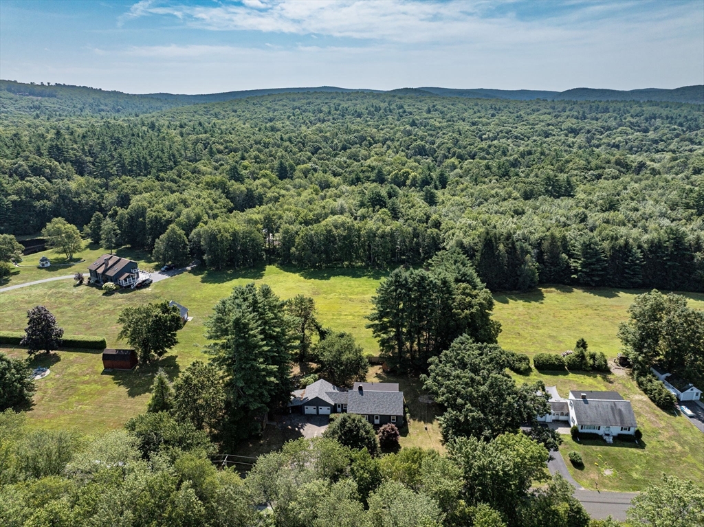 58 Bennett Road Hampden, MA 01036 - Photo 41 of 41 an aerial view of residential houses with outdoor space and trees all around
