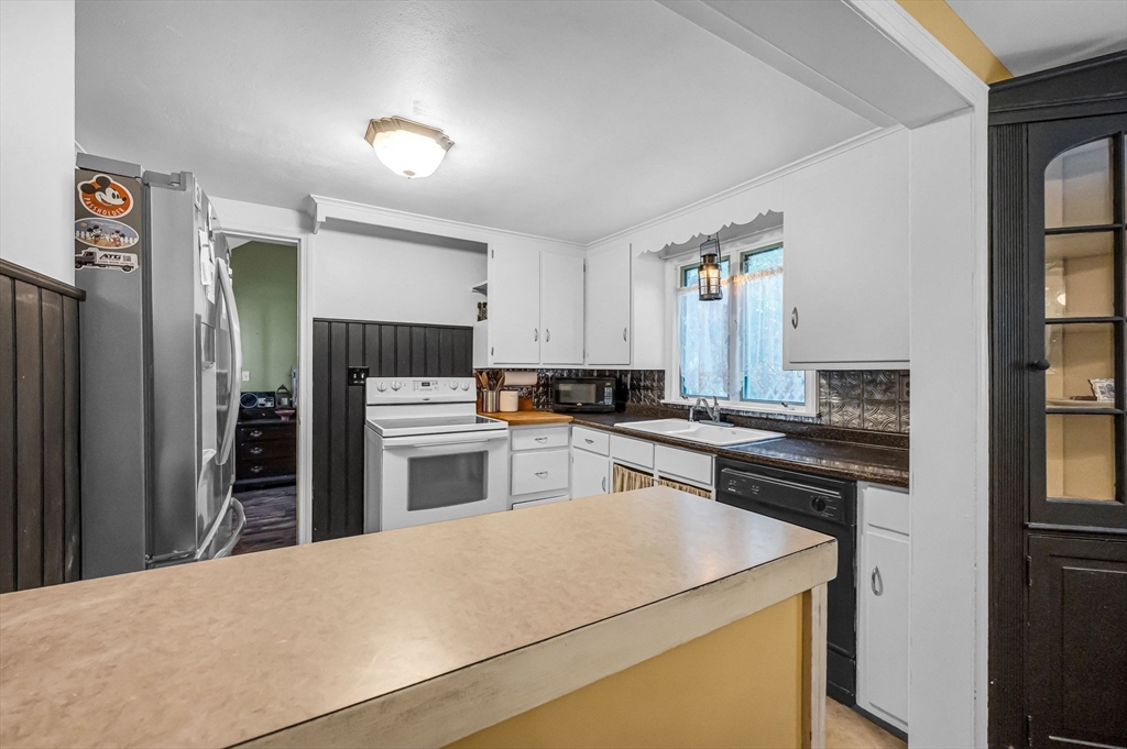 58 Bennett Road Hampden, MA 01036 - Photo 10 of 41 a kitchen with a refrigerator stove and sink