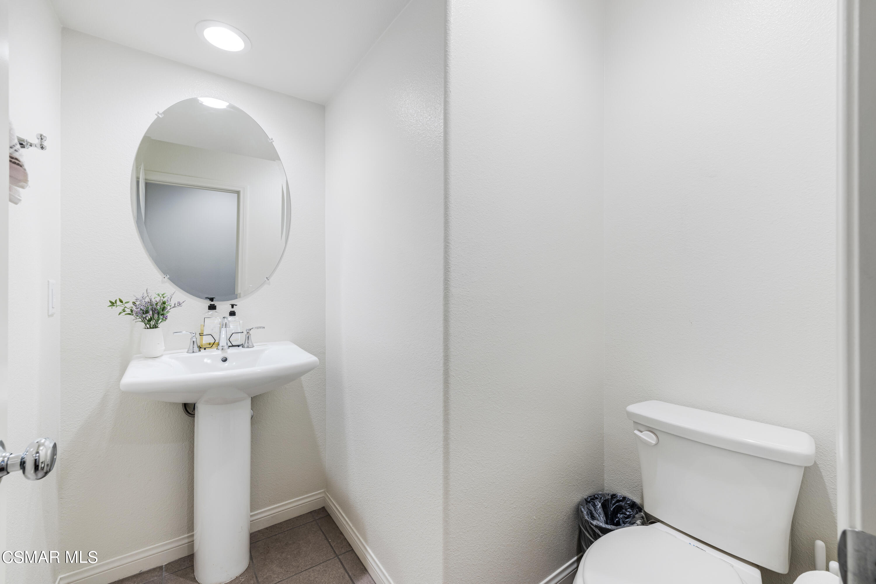 278 Hydrangea Street Fillmore, CA 93015 - Photo 11 of 22 a bathroom with a toilet sink and mirror