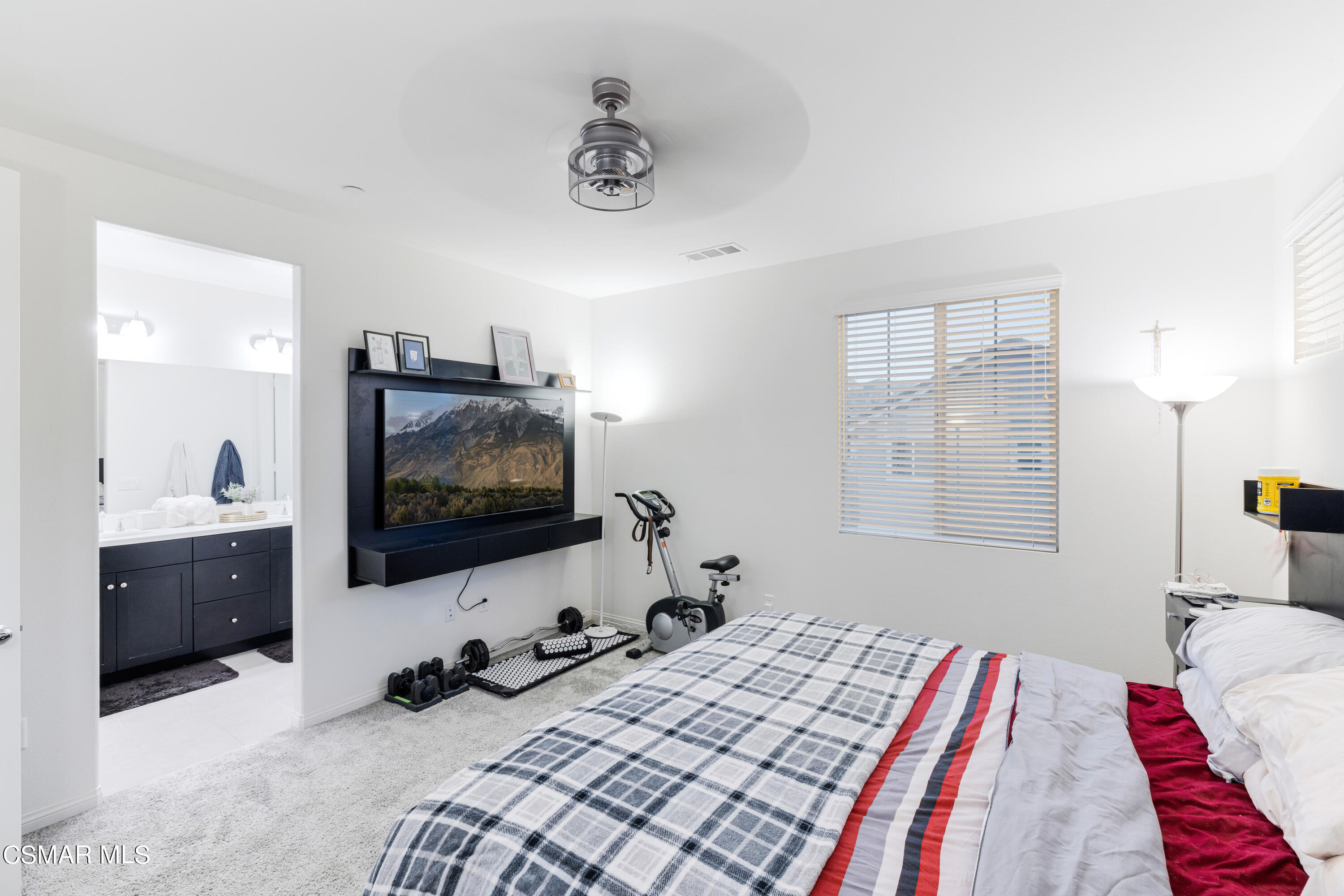 278 Hydrangea Street Fillmore, CA 93015 - Photo 14 of 22 a bedroom with a bed and a flat screen tv