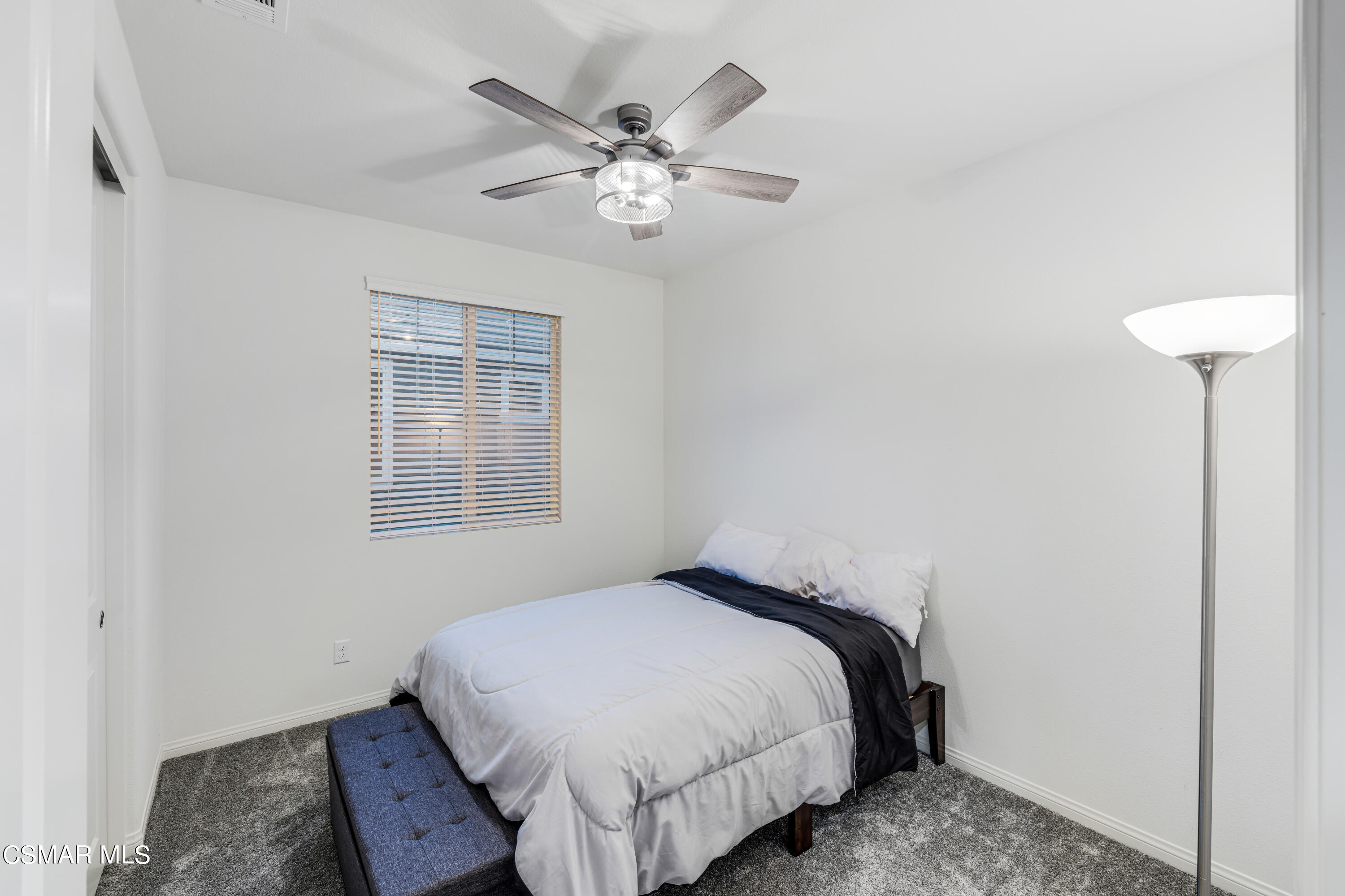278 Hydrangea Street Fillmore, CA 93015 - Photo 17 of 22 a bedroom with a bed and a chandelier