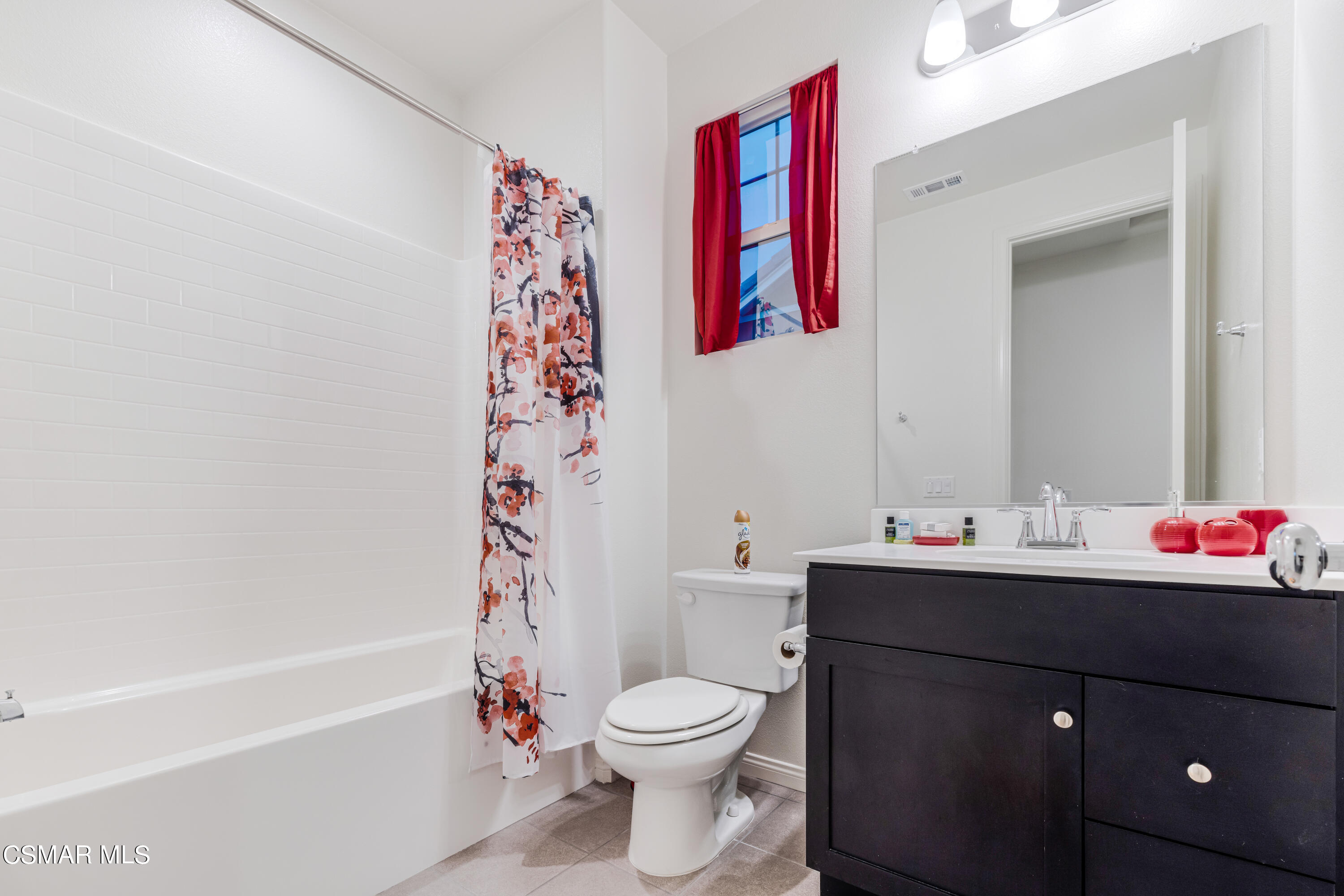 278 Hydrangea Street Fillmore, CA 93015 - Photo 19 of 22 a bathroom with a sink vanity mirror and toilet