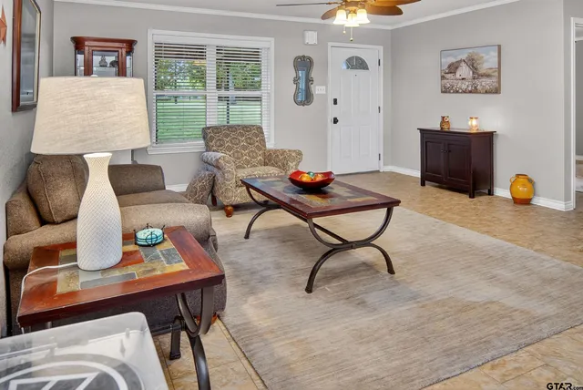a living room with furniture and a flat screen tv