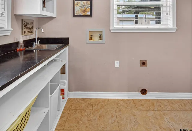 a bathroom with a sink and a granite top