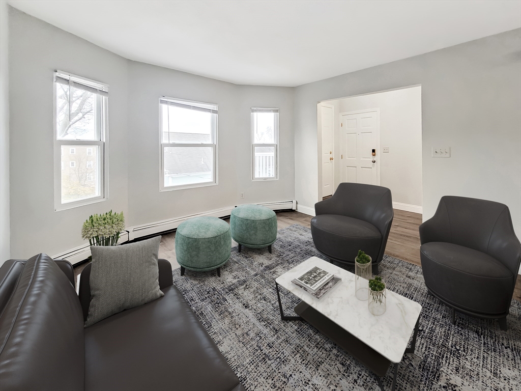 49 Rosedale Street, Unit 3 Boston, MA 02124 - Photo 2 of 10 a living room with furniture and window