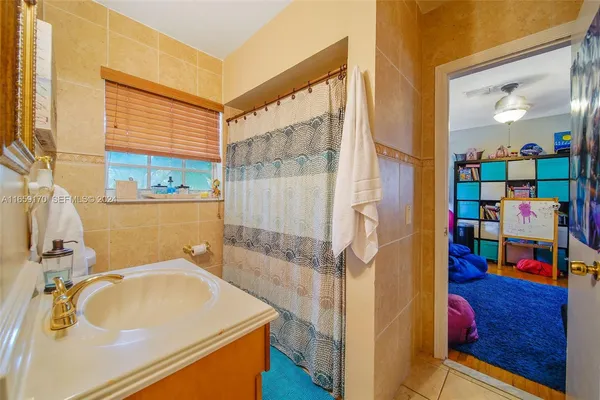 a bathroom with a sink and a shower