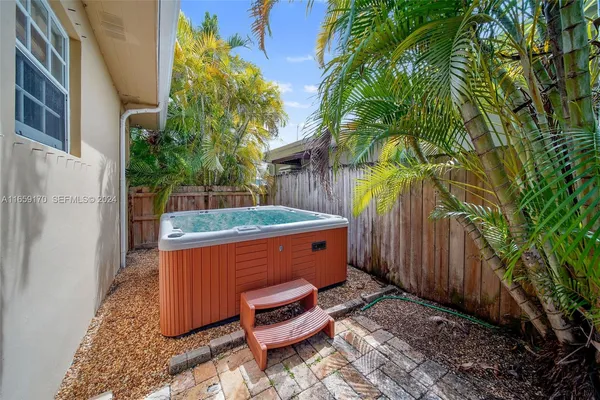 a backyard of a house with outdoor seating