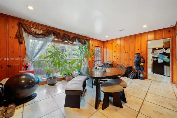 a living room with furniture a window and a table