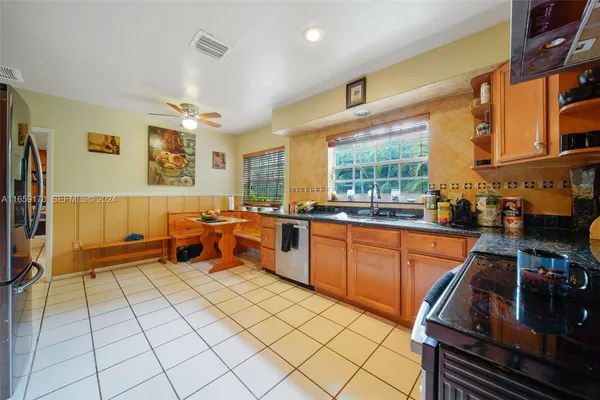 a kitchen with stainless steel appliances lots of counter top space