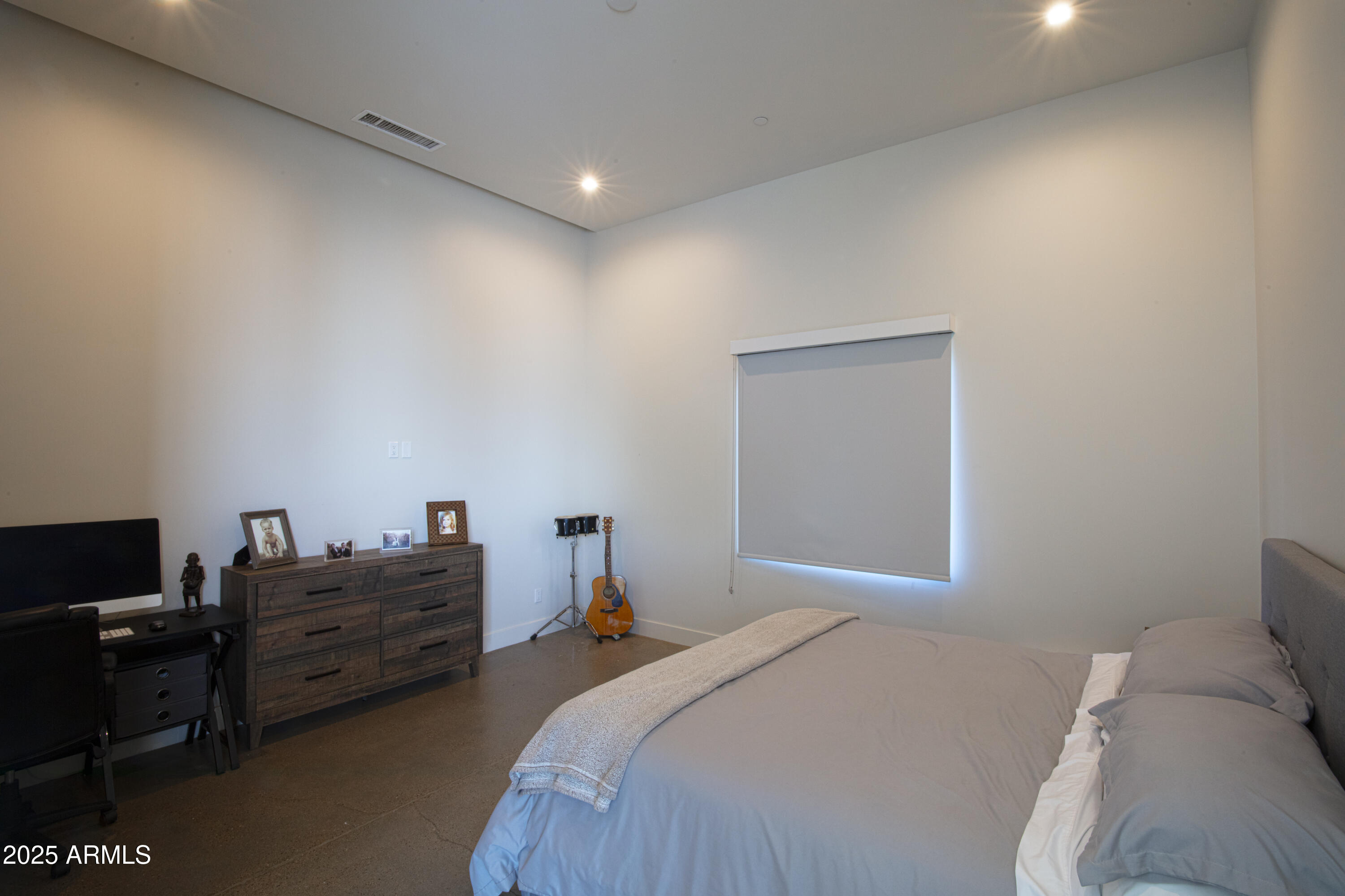 10310 North 37th Street Phoenix, AZ 85028 - Photo 37 of 51 a bedroom with a bed and a television