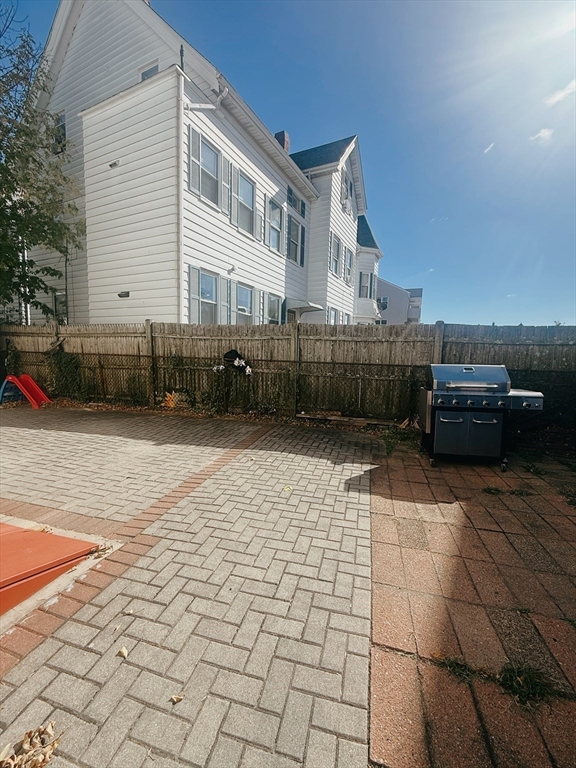 102 Warren Street, Unit 3 Lynn, MA 01905 - Photo 5 of 5 a view of a house with a yard