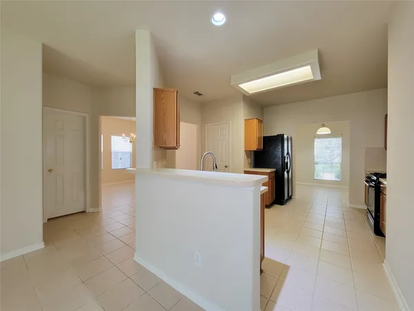 a view of a kitchen and a window