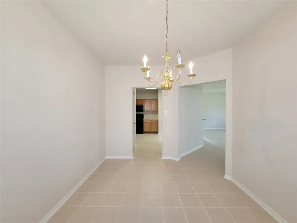 a view of a chandelier in an empty room