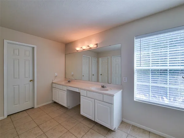 a view of a room with two washing machine and window