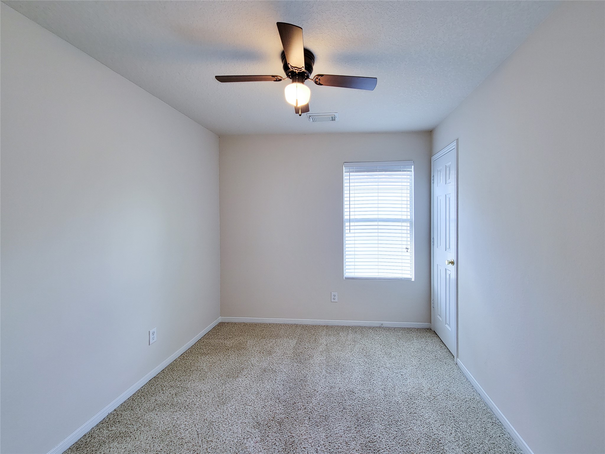 19330 Harvest Stream Way Houston, TX 77084 - Photo 47 of 50 wooden floor in an empty room with a window