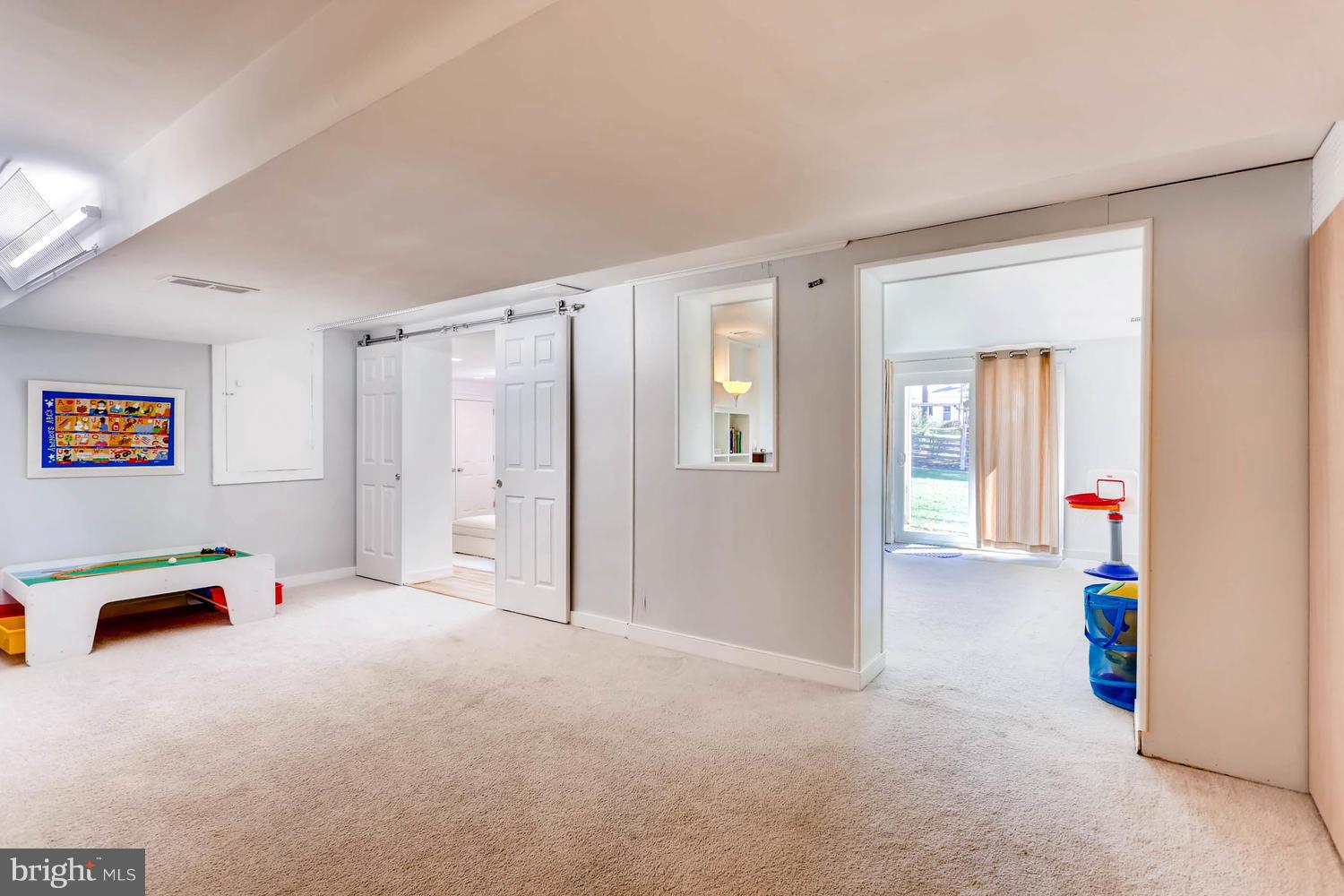 407 Terrace Way Baltimore, MD 21204 - Photo 24 of 28 Finished basement play area, barn doors to BR #5
