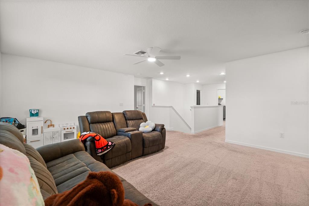 1470 Geranium Drive Mascotte, FL 34753 - Photo 12 of 23 a living room with furniture and a couch