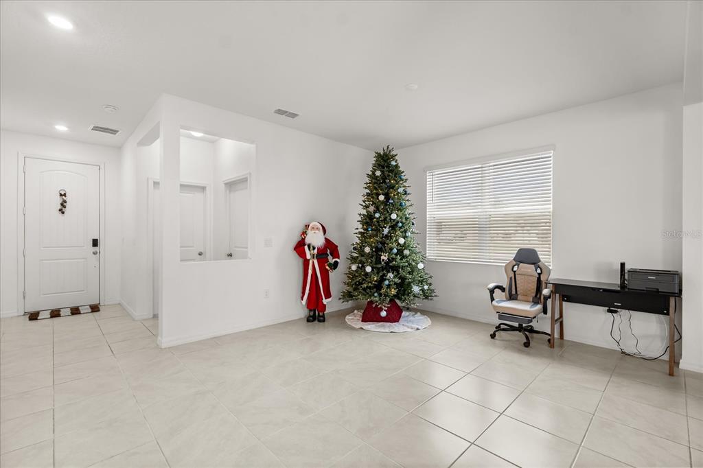 1470 Geranium Drive Mascotte, FL 34753 - Photo 9 of 23 a view of a room with gym equipment