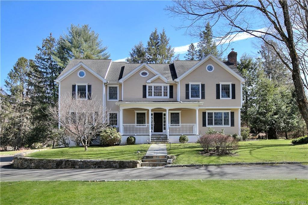 20 Glory Road Weston, CT 06883 - Photo 1 of 1 a front view of a house with a yard
