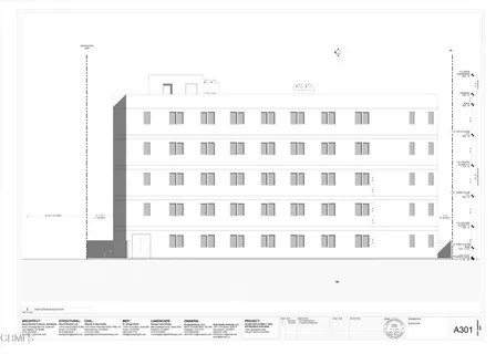 a black and white photo of a black building view