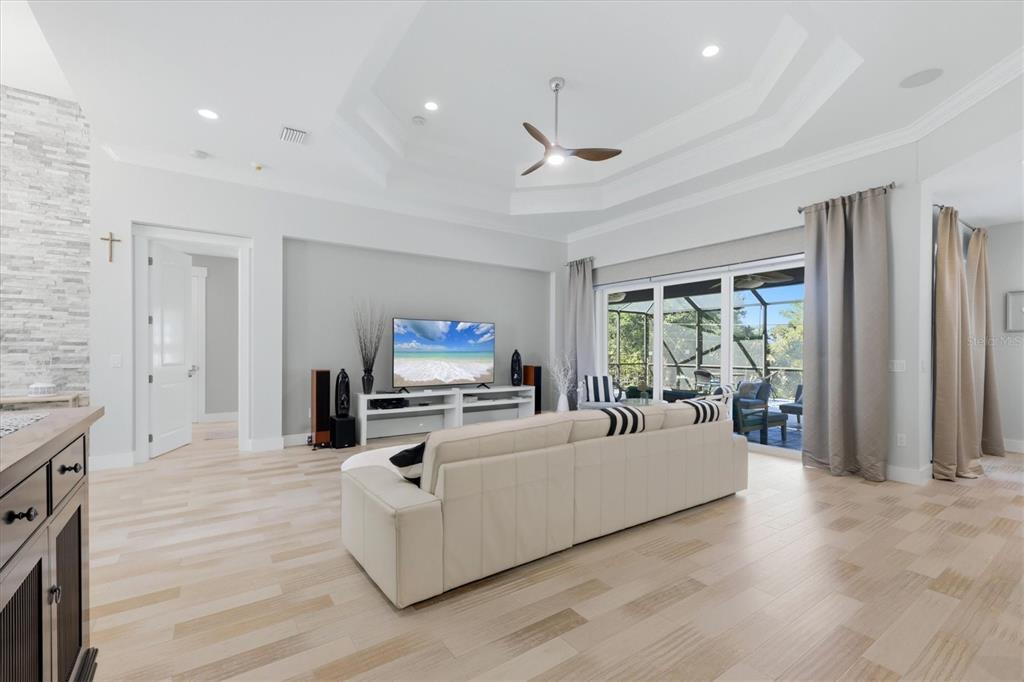 1112 Seneca Road Venice, FL 34293 - Photo 18 of 50 a living room with furniture and a flat screen tv