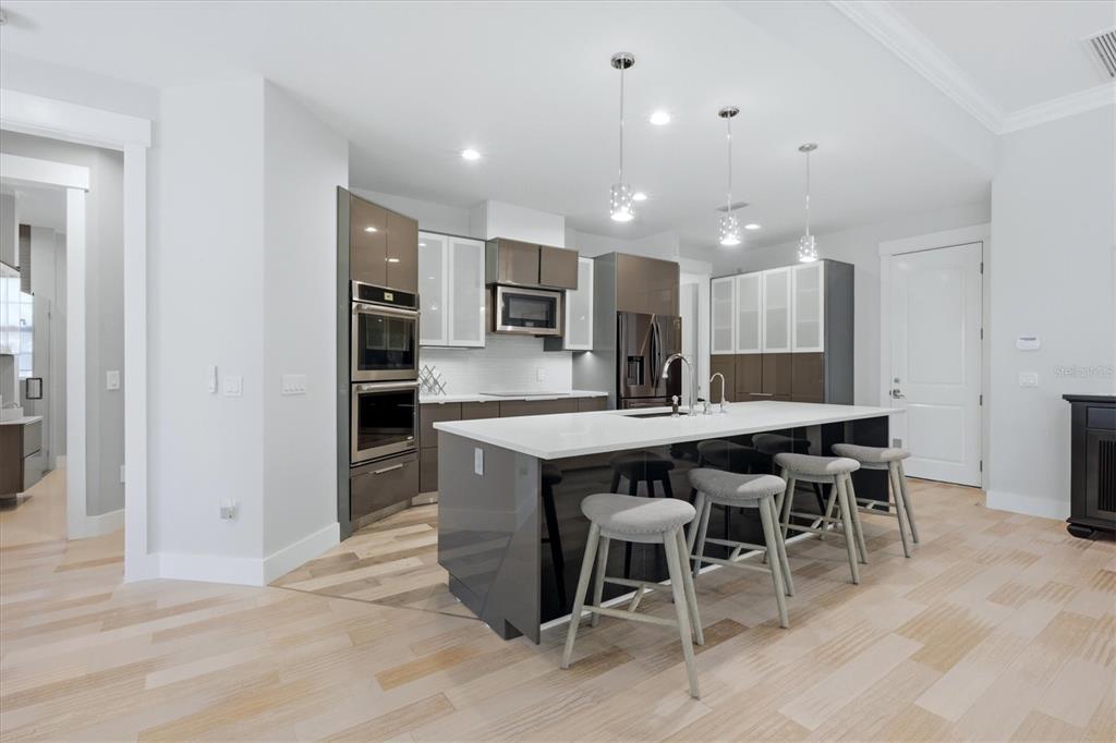 1112 Seneca Road Venice, FL 34293 - Photo 23 of 50 a kitchen with a table and chairs in it
