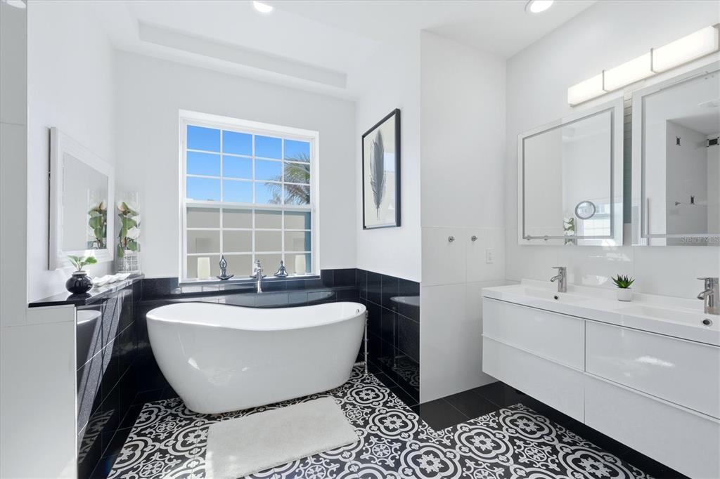 1112 Seneca Road Venice, FL 34293 - Photo 27 of 50 a bathroom with a bathtub and a sink