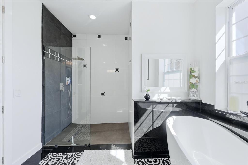 1112 Seneca Road Venice, FL 34293 - Photo 28 of 50 a bath room with a sink and a mirror