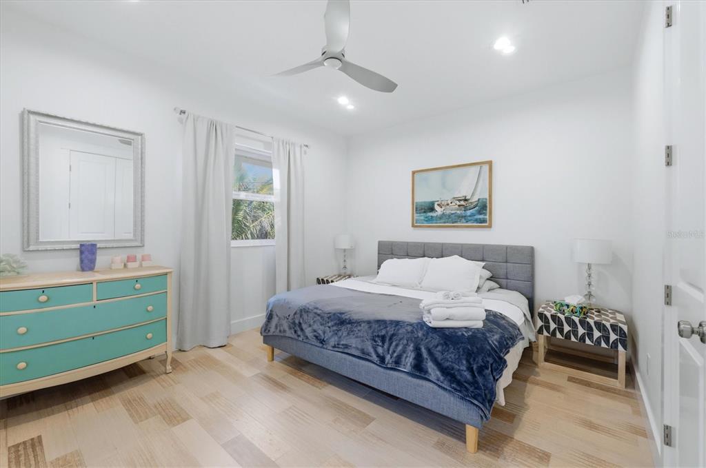 1112 Seneca Road Venice, FL 34293 - Photo 29 of 50 a bedroom with a bed and a window