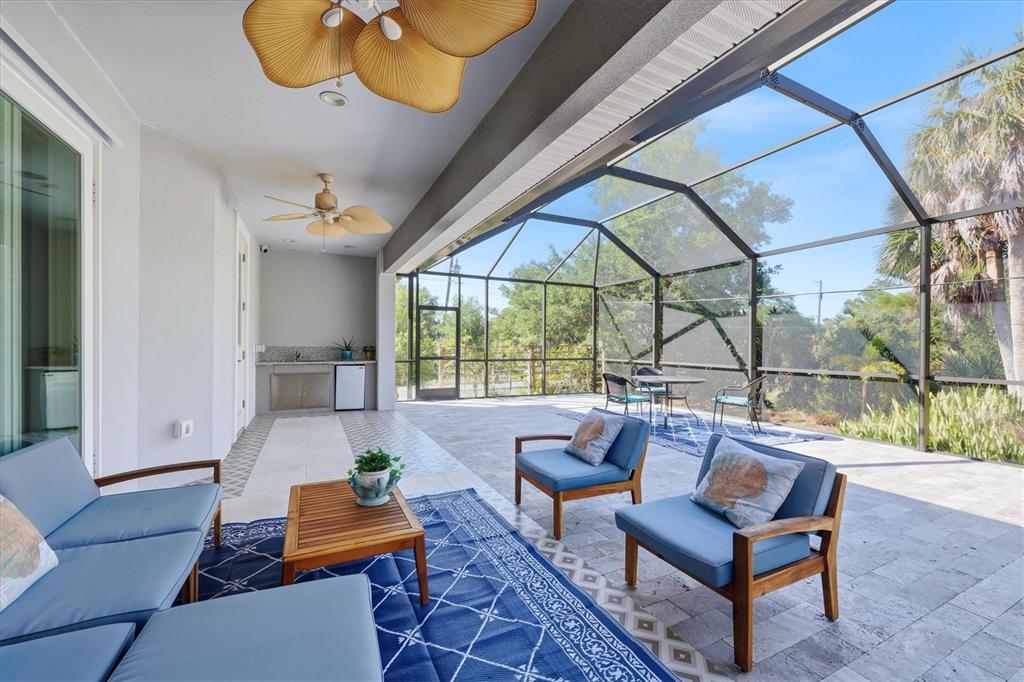 1112 Seneca Road Venice, FL 34293 - Photo 36 of 50 a living room with furniture and a large window
