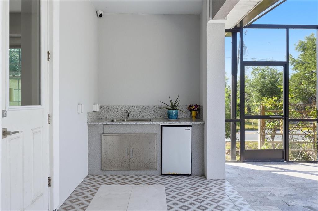 1112 Seneca Road Venice, FL 34293 - Photo 37 of 50 a room with a stove and a window